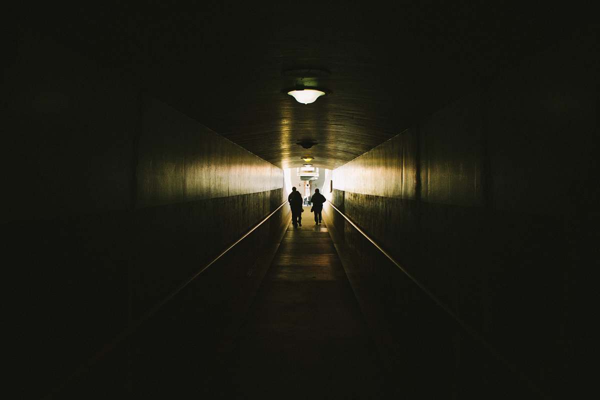 tunnel two person walking between concrete walls union station